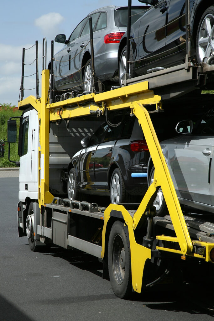 Yellow Open Car Transport Truck with cars